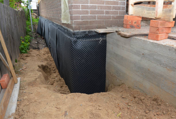 Happy homeowners after waterproofing job in Summerdale
